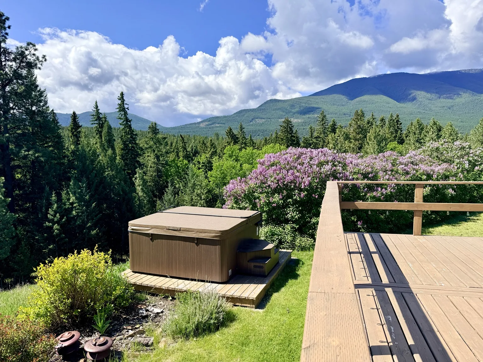 Hot tub overlooking mountain scenery